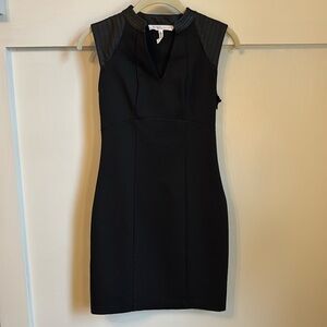 Black BCBG Generation mini dress with leather detailing on shoulders